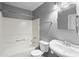 Clean bathroom featuring a tub/shower combination, white toilet and a white vanity with sink at 1979 Resting Creek Dr, Decatur, GA 30035