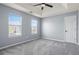 Bright bedroom showcasing two large windows, neutral walls and carpeted floors at 1979 Resting Creek Dr, Decatur, GA 30035