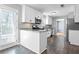 Well-lit kitchen featuring white cabinets, stainless steel appliances and granite counters at 1979 Resting Creek Dr, Decatur, GA 30035