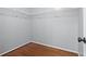 Empty walk-in closet featuring wooden floors and shelving at 1979 Resting Creek Dr, Decatur, GA 30035
