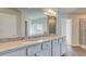 Elegant bathroom with granite countertop, double sinks, and glass-enclosed shower at 212 Eleanora Way, Loganville, GA 30052
