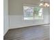 Bright dining room with wainscoting and view of exterior landscape at 212 Eleanora Way, Loganville, GA 30052