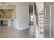 Inviting entryway features hardwood floors, staircase, and an open view of the kitchen at 212 Eleanora Way, Loganville, GA 30052