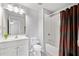 Bright bathroom showcasing a tub and shower combination with a tiled wall and modern fixtures at 273 Amylou Cir, Woodstock, GA 30188