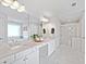 Bright bathroom with double sinks, quartz countertops, and a glass-enclosed shower at 273 Amylou Cir, Woodstock, GA 30188