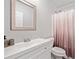 Bathroom featuring a vanity with mirror, toilet, and tub/shower combo with stylish shower curtain at 273 Amylou Cir, Woodstock, GA 30188