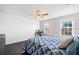 Bright bedroom features two windows and a ceiling fan at 273 Amylou Cir, Woodstock, GA 30188