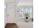 Bright entryway featuring a white door, elegant trim, and large windows for plenty of natural light at 273 Amylou Cir, Woodstock, GA 30188
