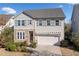 Charming two-story home with stone accents, well-maintained landscaping, and a welcoming front entrance at 273 Amylou Cir, Woodstock, GA 30188