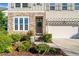 Close up shot of a well landscaped front yard with stone accents on a two-story home at 273 Amylou Cir, Woodstock, GA 30188