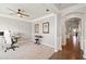 Spacious home office featuring hardwood floors, a ceiling fan, and a stylish workstation at 273 Amylou Cir, Woodstock, GA 30188