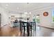 Bright, eat-in kitchen features white cabinets, stainless appliances, and access to the deck at 273 Amylou Cir, Woodstock, GA 30188