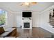 Living room view displays a fireplace, hardwood floors, neutral walls, and natural light at 273 Amylou Cir, Woodstock, GA 30188