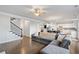 Open-concept living room showcasing hardwood floors, neutral paint, and staircase at 273 Amylou Cir, Woodstock, GA 30188