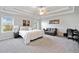Spacious main bedroom with tray ceilings, a ceiling fan, plush carpet, and lots of natural light at 273 Amylou Cir, Woodstock, GA 30188