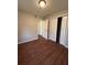 Comfortable bedroom with hardwood floors, a closet, and a neutral palette, providing a blank canvas to customize at 1027 N Born Rd, Stone Mountain, GA 30088