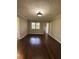 Inviting living room with hardwood floors, and natural light, creating a warm and welcoming atmosphere at 1027 N Born Rd, Stone Mountain, GA 30088