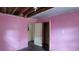 Bedroom needing renovation, pink walls, with view of closet and room at 1182 Bronx Nw St, Atlanta, GA 30314