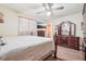 Bedroom showcasing carpet, a ceiling fan, a television, a chest of drawers, and a bed at 1254 Renee Dr, Decatur, GA 30035