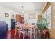 Bright dining room with wood floors, large window, and vintage décor elements at 1254 Renee Dr, Decatur, GA 30035