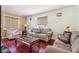 Cozy living room with hardwood floors, patterned wallpaper, and comfortable seating at 1254 Renee Dr, Decatur, GA 30035