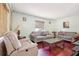 Comfortable living room featuring wood floors, neutral paint, and plush sofas at 1254 Renee Dr, Decatur, GA 30035