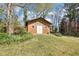 Backyard storage shed featuring double doors and a secure space for tools and equipment at 1254 Renee Dr, Decatur, GA 30035