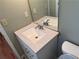 Bathroom featuring a white vanity with light stone countertop and modern faucet at 1848 San Gabriel Ave, Decatur, GA 30032