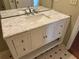 Bathroom vanity featuring a marble countertop, white cabinetry, and ample storage space at 1848 San Gabriel Ave, Decatur, GA 30032
