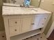Bathroom vanity featuring a marble countertop, white cabinetry, and ample storage space at 1848 San Gabriel Ave, Decatur, GA 30032