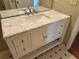 Bathroom vanity featuring marble countertop, white cabinets, and chrome fixtures at 1848 San Gabriel Ave, Decatur, GA 30032