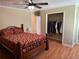 Bedroom featuring a ceiling fan, wood flooring, and closet at 1848 San Gabriel Ave, Decatur, GA 30032