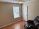 Bedroom featuring a window, neutral walls, ceiling fan, and a chair at 1848 San Gabriel Ave, Decatur, GA 30032