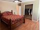 Cozy bedroom featuring a ceiling fan, wood flooring, and closet at 1848 San Gabriel Ave, Decatur, GA 30032