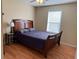 Bedroom featuring a wood bed frame, laminate flooring, and a window at 1848 San Gabriel Ave, Decatur, GA 30032