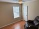 Cozy bedroom featuring a ceiling fan, natural light from a window, and warm-toned walls at 1848 San Gabriel Ave, Decatur, GA 30032