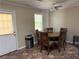 Eat in kitchen area features an exterior door, window, and seating for four at 1848 San Gabriel Ave, Decatur, GA 30032