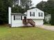 Charming split-level home with a two-car garage, a wood deck, and a well-maintained front yard at 1848 San Gabriel Ave, Decatur, GA 30032