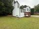 Charming split-level home with a wood deck, chimney, and well-maintained landscaping with fresh mulch at 1848 San Gabriel Ave, Decatur, GA 30032