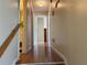 Hallway view from top of stairs features hardwood floors and neutral wall color at 1848 San Gabriel Ave, Decatur, GA 30032