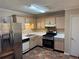 Well-equipped kitchen features stainless steel refrigerator and gas range at 1848 San Gabriel Ave, Decatur, GA 30032