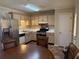 Cozy kitchen featuring stainless steel appliances, tile backsplash, and light wood cabinets at 1848 San Gabriel Ave, Decatur, GA 30032