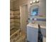 Bathroom featuring tiled walls and floor with a new toilet and vanity at 2103 River Rd, Ellenwood, GA 30294