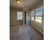 Bright bedroom featuring neutral walls, carpet, and multiple windows at 2103 River Rd, Ellenwood, GA 30294