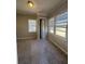 Bright bedroom featuring neutral walls, carpet, and multiple windows at 2103 River Rd, Ellenwood, GA 30294