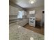 Kitchen featuring white cabinets, granite counters, and modern appliances at 2103 River Rd, Ellenwood, GA 30294