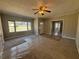 Inviting living room with large windows and neutral paint, ready for your personal touch at 2103 River Rd, Ellenwood, GA 30294