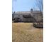 Back of house with large deck and open lawn area at 210 Vintage Dr, Covington, GA 30014