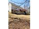 House with deck and patio offers outdoor living space with a lawn area at 210 Vintage Dr, Covington, GA 30014