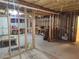 Unfinished basement with exposed framing, offering a blank canvas for customization and storage at 210 Vintage Dr, Covington, GA 30014